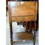 Small oak cupboard with slide top and barley twist legs, and a surveyor's measure.