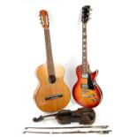 Solid body electric rhythm guitar, Resonata acoustic guitar and violin with two bows .