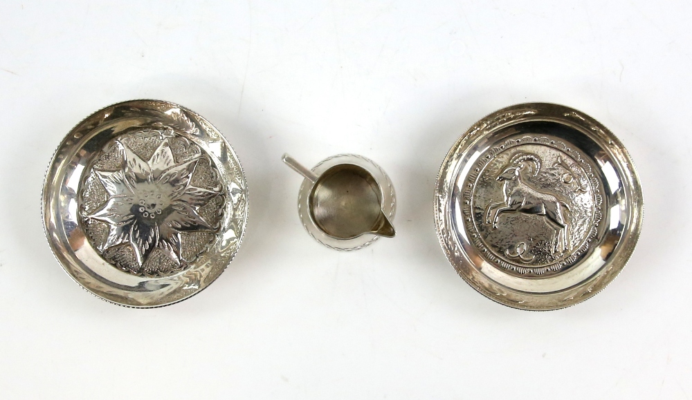 Two continental silver 830 grade dishes one with antelope designs the other floral and an 800