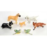 Five Beswick dogs and two bluetits.