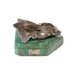 Novel silver paperweight/sculpture in the form of a coy carp fish on a green marble base .