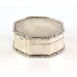 Silver octagonal snuff box with scrolled border by Deakin and Francis, Birmingham 1917.