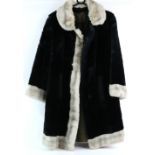Harrods of London blond faux fur coat another two one in black with white trim .
