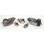 Five hand painted sculptures of wild ducks all signed and named .
