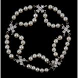 Tiffany & Co pearl and diamond 'Floret Flourishes' bracelet, five floral diamond set links,