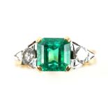 Emerald and diamond ring, with central step cut emerald of 2.02 carats, two brilliant cut