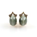 Contemporary chrysoberyl cats eye earrings, each cabochon measuring 12 x 9mm, set with round