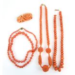 A group of vintage coral, two single strand necklaces to barrel clasps, a multi bead necklace, and a