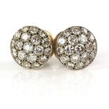 Pair of vintage diamond earrings set with old and brilliant cut diamonds in unmarked white gold .