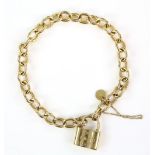 Tiffany & Co gold padlock bracelet in 18 ct yellow gold with safety chain. CONDITION18 ct gross