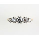 Five stone diamond ring set with brilliant cut stones, estimated diamond weight 0.90 carat, in