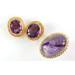 A pair of gold amethyst set earrings in rope twist mounts, testing as 18 ct , length 3 cm and an