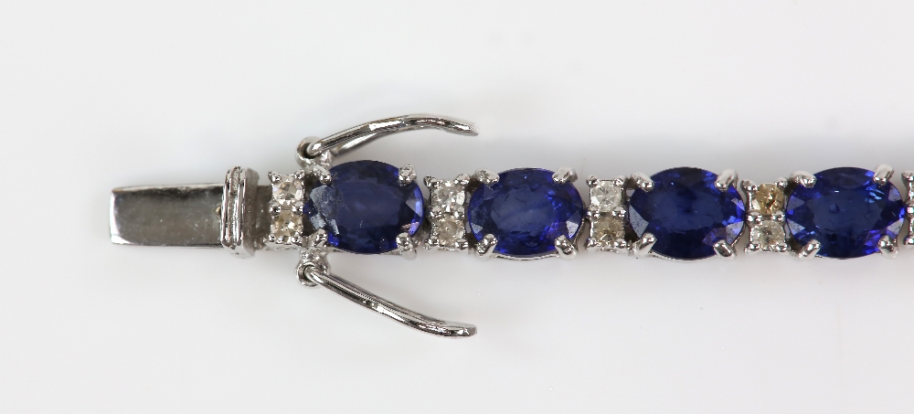 Sapphire diamond line bracelet; twenty-six oval faceted sapphires are four-claw set and alternated - Image 4 of 8