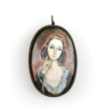 Enamel plaque with portrait of a young lady in base metal frame, 6.2 x 3.5cm . CONDITION gross