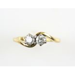 Two stone diamond crossover ring, set with brilliant cut stones, estimated diamond weight 0.55