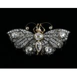 Late Victorian antique diamond butterfly en tremblant brooch, set with ruby cabochon cut eyes, the