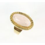 Vintage 1970's rose quartz dress ring, central cabochon cut rose quartz 15 x 8mm, in fluted setting,