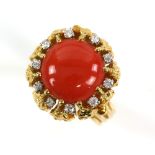 1970's ring by Hans Georg Mautner, centrally set with round cabochon coral, 11mm in diameter, set