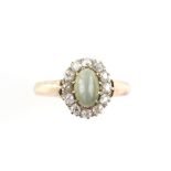Victorian ring, central oval cabochon chrysoberyl cats eye, 8 x 5mm, surrounded by twelve old cut