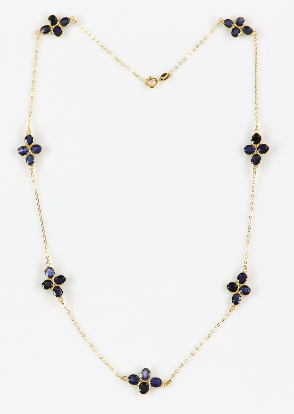 Sapphire cluster necklace; seven clusters of four oval faceted sapphires in floral formation