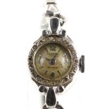 Olesen, A ladies diamond set cocktail watch , the set bezel surmounting a silvered dial set with