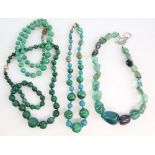Four gem stone necklaces, one strung with malachite and turquoise beads, with unmarked gold clasp,