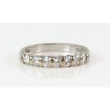 Diamond half eternity ring, set with seven round brilliant cut diamonds, estimated total diamond