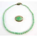 A Vintage jadeite jade graduated necklace to a marquise form gold clasp, testing as 14 ct, length 42