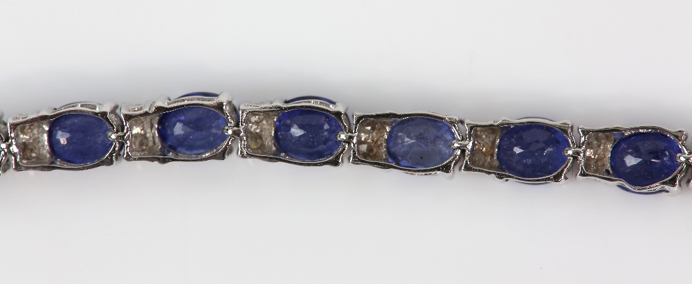 Sapphire diamond line bracelet; twenty-six oval faceted sapphires are four-claw set and alternated - Image 8 of 8