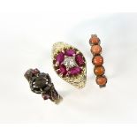 Ruby and diamond ring, set with single old cut stone and oval rubies, in scroll decorated mount,
