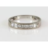 Diamond half eternity ring, set with seven Ascher cut diamonds, estimated total diamond weight 0.