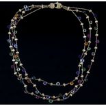 Marco Bicego, a gold multi gem necklace, the three strands set with textured gold beads, tourmaline,