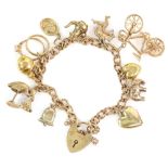 Vintage charm bracelet, flat curb link chain, with heart padlock clasp, with eleven charms,