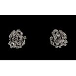 A pair of diamond spray earrings, set with round brilliant cut diamonds, estimated total diamond
