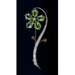Vintage flower spray brooch set with fancy yellow and white diamonds and pear cut peridot stones,