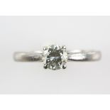 Diamond solitaire ring, with a brilliant cut stone estimated at 0.75 carats, mounted in platinum,