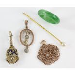 Mixed group of items, an Edwardian pendant with a chain, marked 9 ct a jade ring, pearl stick pin