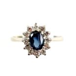 Vintage dress ring, central oval cut sapphire, surrounded by swiss cut diamonds, mounted in 18 ct