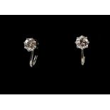 A pair of round brilliant cut diamond earrings, estimated total diamond weight 0.80 carats,