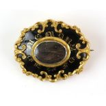 Victorian gold mourning brooch,' In Memory of ' in gilt lettering on black enamel, central