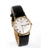 W H Winegarten gentleman's gold wrist watch the white enamel dial with black roman numerals,minute