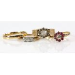 Four gold rings, Swiss cut diamond three stone rings, mounted in platinum and 9 ct, ring size K,