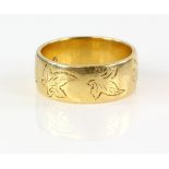Gold wedding band with leaf decoration, 18 ct hallmarked, ring size M 1/2 . CONDITION slight wear to