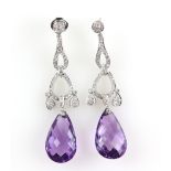 A pair of contemporary diamond earrings with amethyst drops; pear-shaped faceted amethysts suspended