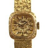 Longines A ladies Reference 3225.0 gold dress watch, the signed dial with baton hour markers, and