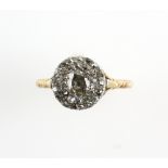 18th C diamond ring, set with old cut stones in a closed back setting, central diamond, 6 x 5.2 mm