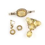 Citrine set jewellery, a pendant set with four oval cut each oval cut approximately 14 x 10mm,
