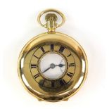 Gold half hunter pocket watch, enamelled dial marked Record, with black roman numeral hour markers ,