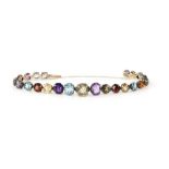 Edwardian multi gem set bracelet, the graduated faceted stones, set in silver with gold back, stones