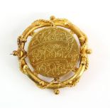 19th C brooch with rope border set with an Indian, Bengali coin, mount testing as 22 ct.